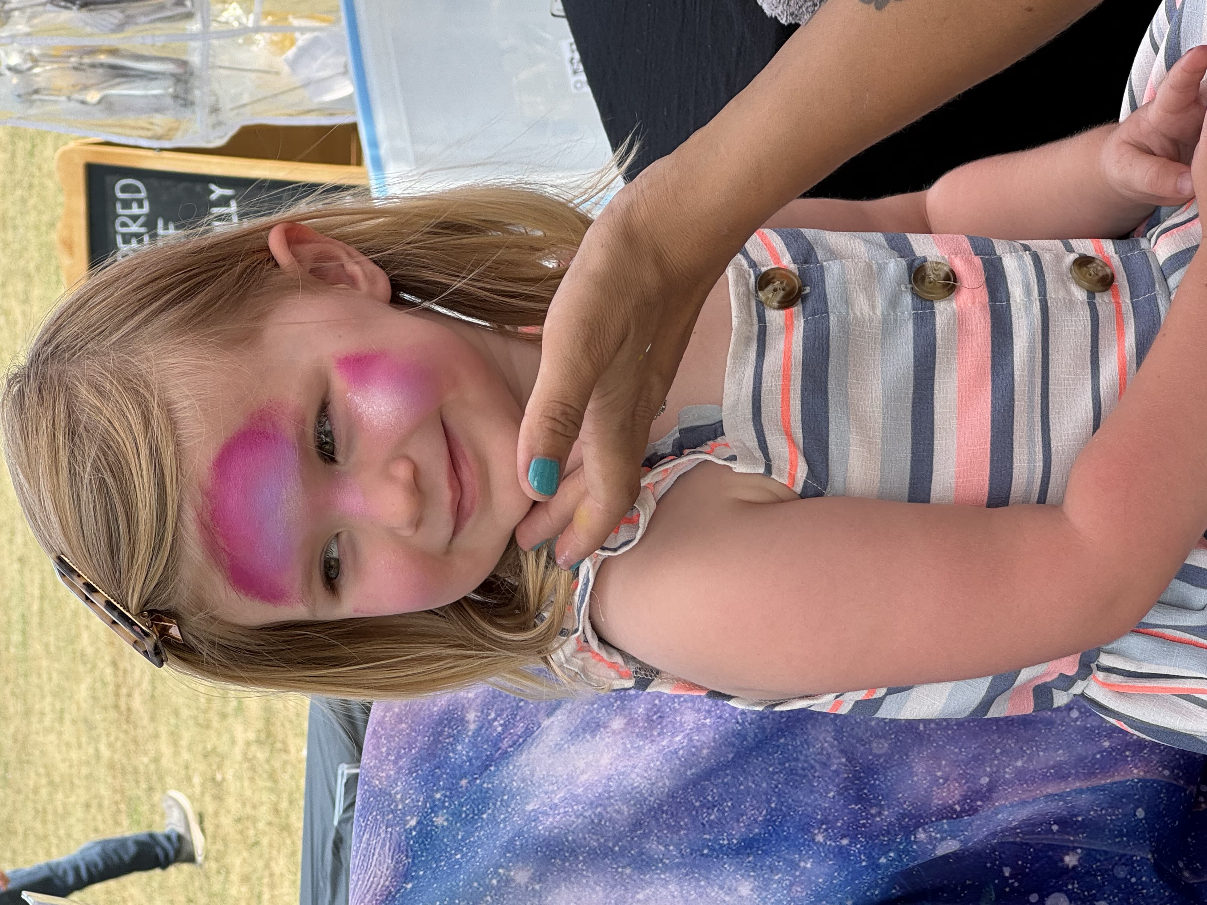 Imogen with her face painted.